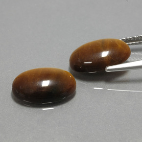Tiger's Eye طبيعي بلون بني ذهبي، وزن ‎‎ قيراط، شكل بيضاوى، مقاس ‎14x10‎ مم