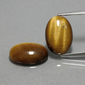 Tiger's Eye طبيعي بلون بني ذهبي، وزن ‎‎ قيراط، شكل بيضاوى، مقاس ‎14x10‎ مم