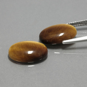 Tiger's Eye طبيعي بلون بني ذهبي، وزن ‎‎ قيراط، شكل بيضاوى، مقاس ‎14x10‎ مم