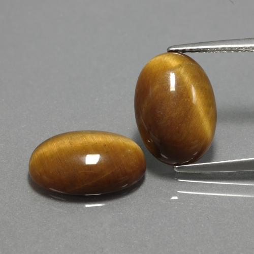 Tiger's Eye طبيعي بلون بني ذهبي، وزن ‎9.04‎ قيراط، شكل بيضاوى، مقاس ‎14x10‎ مم