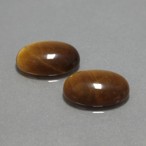 Tiger's Eye طبيعي بلون بني ذهبي، وزن ‎9.04‎ قيراط، شكل بيضاوى، مقاس ‎14x10‎ مم