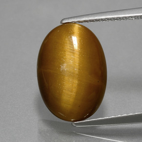 Tiger's Eye طبيعي بلون بني ذهبي، وزن ‎4.49‎ قيراط، شكل بيضاوى، مقاس ‎14x10‎ مم
