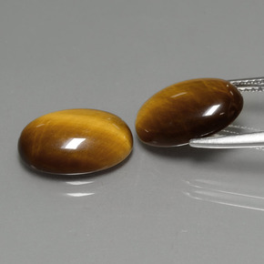 Tiger's Eye طبيعي بلون بني ذهبي، وزن ‎‎ قيراط، شكل بيضاوى، مقاس ‎14x10‎ مم