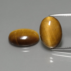 Tiger's Eye طبيعي بلون بني ذهبي، وزن ‎‎ قيراط، شكل بيضاوى، مقاس ‎14x10‎ مم