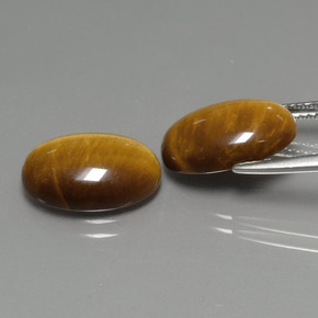 Tiger's Eye طبيعي بلون بني ذهبي، وزن ‎‎ قيراط، شكل بيضاوى، مقاس ‎14x10‎ مم