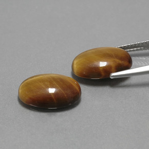 أحجار عين النمر ذهب البنى طبيعية، قصة بيضاوى، غير شفاف، وزنها  قيراط