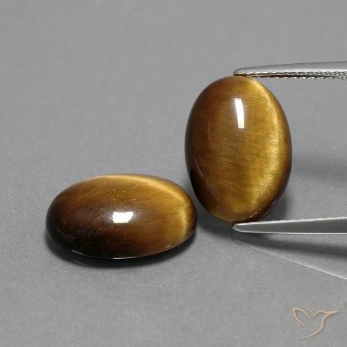 أحجار عين النمر بني ذهبي طبيعية، قصة بيضاوى، غير شفاف، وزنها 9.00 قيراط