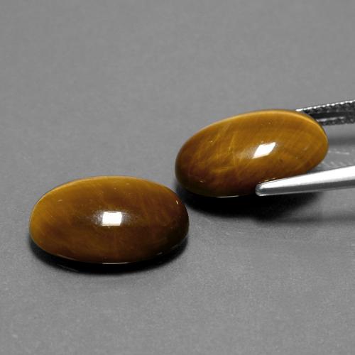 أحجار عين النمر بني ذهبي طبيعية، قصة بيضاوى، غير شفاف، وزنها 8.94 قيراط