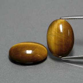 Tiger's Eye طبيعي بلون بني ذهبي، وزن ‎‎ قيراط، شكل بيضاوى، مقاس ‎14x10‎ مم