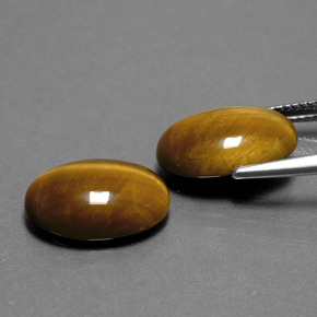 Tiger's Eye طبيعي بلون بني ذهبي، وزن ‎‎ قيراط، شكل بيضاوى، مقاس ‎14x10‎ مم