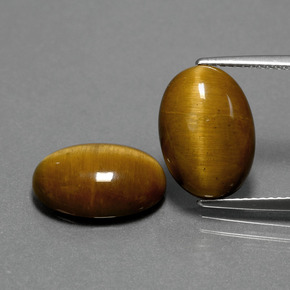 Tiger's Eye طبيعي بلون بني ذهبي، وزن ‎‎ قيراط، شكل بيضاوى، مقاس ‎14x10‎ مم