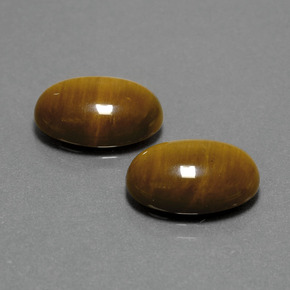 Tiger's Eye طبيعي بلون بني ذهبي، وزن ‎‎ قيراط، شكل بيضاوى، مقاس ‎14x10‎ مم
