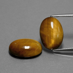 Tiger's Eye طبيعي بلون بني ذهبي، وزن ‎‎ قيراط، شكل بيضاوى، مقاس ‎14.1x10‎ مم
