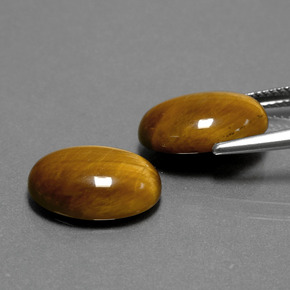 Tiger's Eye طبيعي بلون بني ذهبي، وزن ‎‎ قيراط، شكل بيضاوى، مقاس ‎14.1x10‎ مم