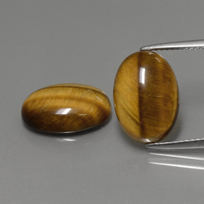 Tiger's Eye طبيعي بلون بني ذهبي، وزن ‎‎ قيراط، شكل بيضاوى، مقاس ‎14x10‎ مم
