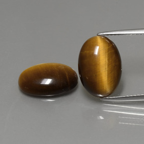 Tiger's Eye طبيعي بلون بني ذهبي، وزن ‎‎ قيراط، شكل بيضاوى، مقاس ‎14x10‎ مم