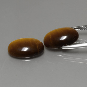 Tiger's Eye طبيعي بلون بني ذهبي، وزن ‎‎ قيراط، شكل بيضاوى، مقاس ‎14x10‎ مم