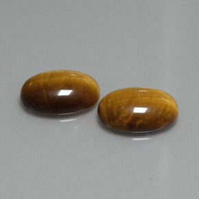 Tiger's Eye طبيعي بلون بنى دافئ، وزن ‎9.08‎ قيراط، شكل بيضاوى، مقاس ‎14x10‎ مم