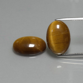 Tiger's Eye طبيعي بلون بنى متوسط، وزن ‎9.04‎ قيراط، شكل بيضاوى، مقاس ‎14x10‎ مم