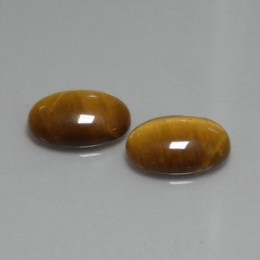 Tiger's Eye طبيعي بلون بنى متوسط، وزن ‎9.04‎ قيراط، شكل بيضاوى، مقاس ‎14x10‎ مم