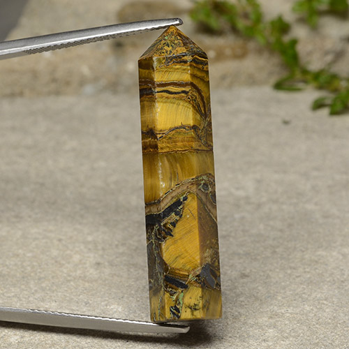 Tiger's Eye طبيعي بلون بنى داكن-متوسط، وزن ‎23.84‎ قيراط، شكل شكل خيالي، مقاس ‎36.1x8.7‎ مم