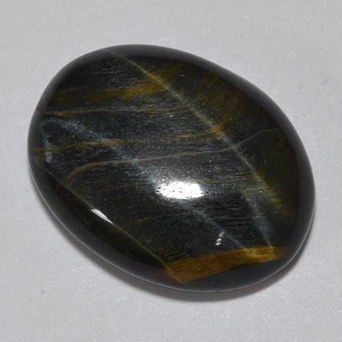 Tiger's Eye طبيعي بلون متعدد الألوان، وزن ‎11.75‎ قيراط، شكل بيضاوى، مقاس ‎18.2x13.9‎ مم