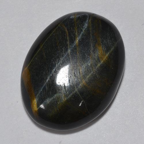 Tiger's Eye طبيعي بلون متعدد الألوان، وزن ‎11.75‎ قيراط، شكل بيضاوى، مقاس ‎18.2x13.9‎ مم