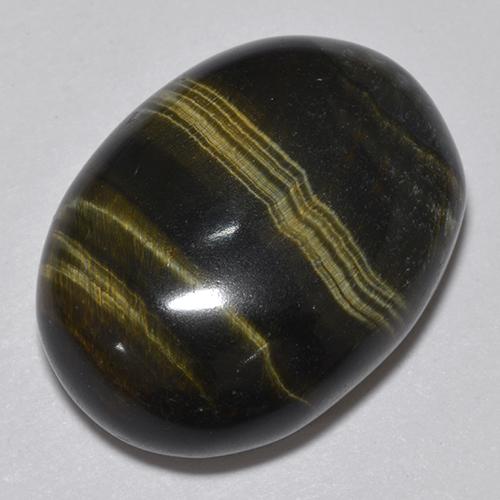 Tiger's Eye طبيعي بلون متعدد الألوان، وزن ‎19.06‎ قيراط، شكل بيضاوى، مقاس ‎19.4x14.6‎ مم