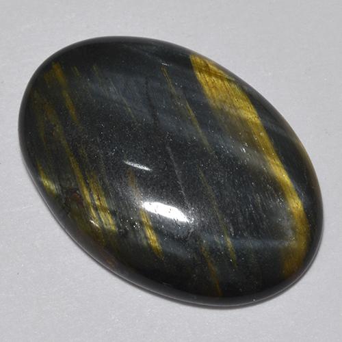 Tiger's Eye طبيعي بلون متعدد الألوان، وزن ‎9.44‎ قيراط، شكل بيضاوى، مقاس ‎20.6x14.4‎ مم