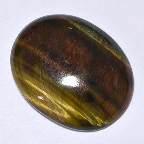Tiger's Eye طبيعي بلون متعدد الألوان، وزن ‎24.66‎ قيراط، شكل بيضاوى، مقاس ‎25.3x20.2‎ مم