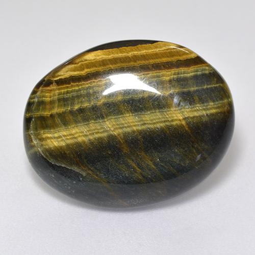 Tiger's Eye طبيعي بلون متعدد الألوان، وزن ‎12.92‎ قيراط، شكل بيضاوى، مقاس ‎19.8x15.7‎ مم