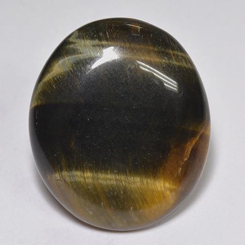 Tiger's Eye طبيعي بلون متعدد الألوان، وزن ‎14.43‎ قيراط، شكل بيضاوى، مقاس ‎20.6x17.6‎ مم