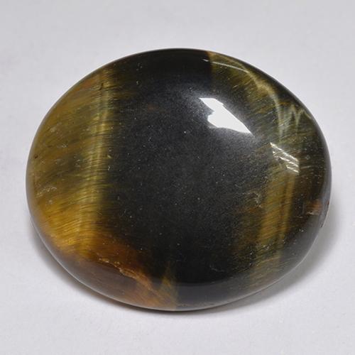 Tiger's Eye طبيعي بلون متعدد الألوان، وزن ‎14.43‎ قيراط، شكل بيضاوى، مقاس ‎20.6x17.6‎ مم