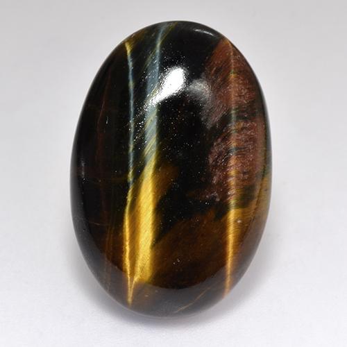 Tiger's Eye طبيعي بلون متعدد الألوان، وزن ‎18.46‎ قيراط، شكل بيضاوى، مقاس ‎23.4x15.8‎ مم