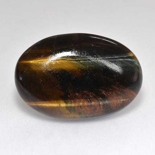 Tiger's Eye طبيعي بلون متعدد الألوان، وزن ‎18.46‎ قيراط، شكل بيضاوى، مقاس ‎23.4x15.8‎ مم