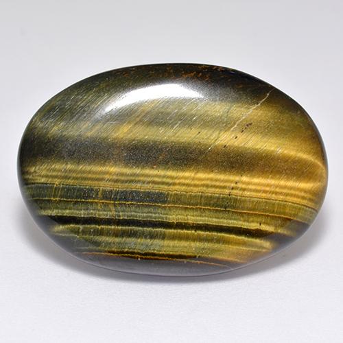 Tiger's Eye طبيعي بلون بنى دافئ، وزن ‎23.65‎ قيراط، شكل بيضاوى، مقاس ‎27.6x19‎ مم