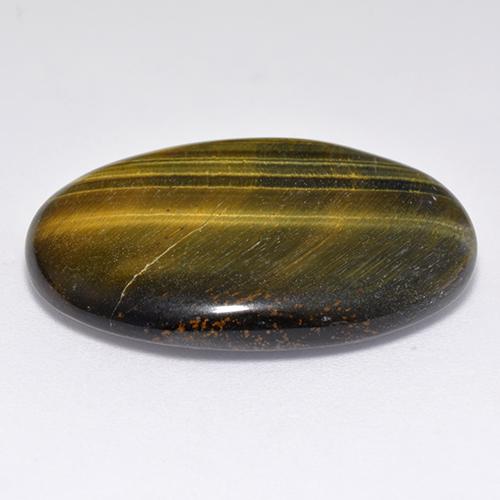 Tiger's Eye طبيعي بلون بنى دافئ، وزن ‎23.65‎ قيراط، شكل بيضاوى، مقاس ‎27.6x19‎ مم