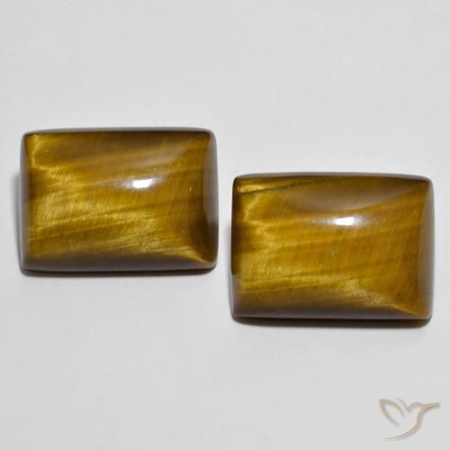 Tiger's Eye طبيعي بلون بني مصفر، وزن ‎26.73‎ قيراط، شكل باغيت، مقاس ‎18.2x13.3‎ مم