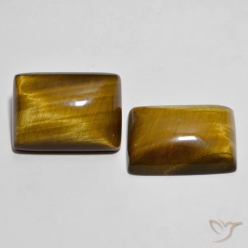 Tiger's Eye طبيعي بلون بني مصفر، وزن ‎26.73‎ قيراط، شكل باغيت، مقاس ‎18.2x13.3‎ مم