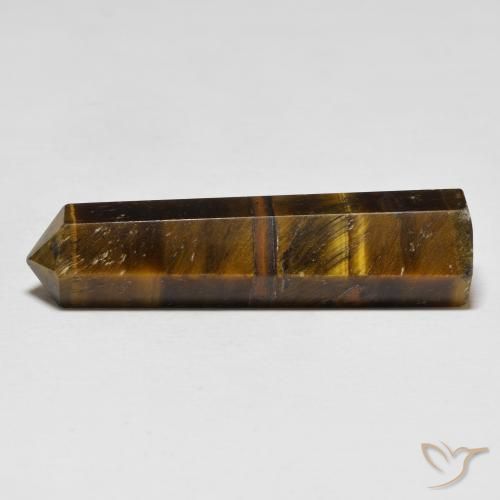 Tiger's Eye طبيعي بلون بنى الأرز، وزن ‎26.11‎ قيراط، شكل شكل خيالي، مقاس ‎37x10‎ مم
