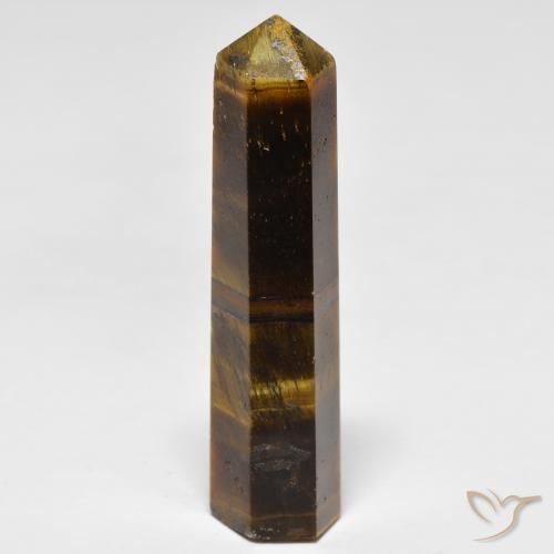 Tiger's Eye طبيعي بلون بنى الأرز، وزن ‎26.11‎ قيراط، شكل شكل خيالي، مقاس ‎37x10‎ مم