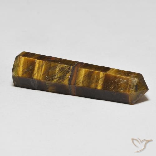 Tiger's Eye طبيعي بلون بنى الأرز، وزن ‎26.11‎ قيراط، شكل شكل خيالي، مقاس ‎37x10‎ مم