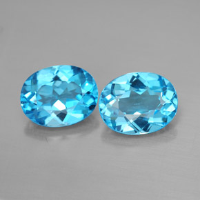 توباز طبيعي بلون أزرق سويسري، وزن ‎‎ قيراط، شكل بيضاوى، مقاس ‎9.2x7.2‎ مم
