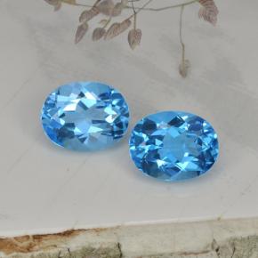 توباز طبيعي بلون أزرق سويسري، وزن ‎4.93‎ قيراط، شكل بيضاوى، مقاس ‎9.1x7.1‎ مم