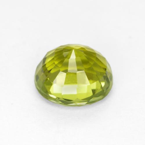 تورمالين طبيعي بلون أخضر مصفر، وزن ‎1.11‎ قيراط، شكل بيضاوى، مقاس ‎6.5x6.1‎ مم