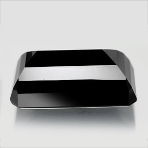 تورمالين طبيعي بلون أسود، وزن ‎22.79‎ قيراط، شكل قص الزمرد، مقاس ‎21.2x12.5‎ مم