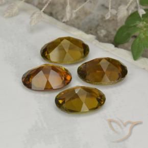 أحجار تورمالين بنى دافئ طبيعية، بيضوي، VVS-VS، وزنها 3.01 قيراط