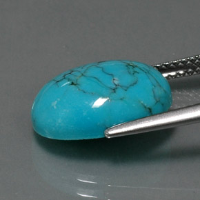 فيروز طبيعي بلون أزرق، وزن ‎4.12‎ قيراط، شكل بيضاوى، مقاس ‎13.9x9.9‎ مم