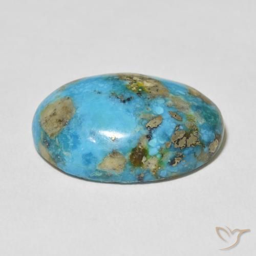 فيروز طبيعي بلون أزرق مخضر فاتح، وزن ‎20.10‎ قيراط، شكل بيضاوى، مقاس ‎22x15.9‎ مم