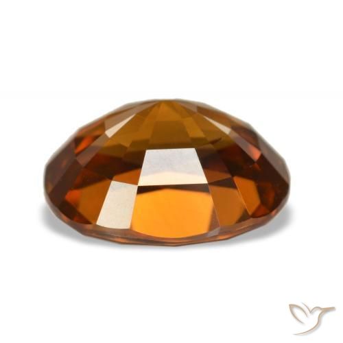 زركون طبيعي بلون Medium Dark-Orange، وزن ‎5.52‎ قيراط، شكل بيضاوى، مقاس ‎10.5x8.8‎ مم